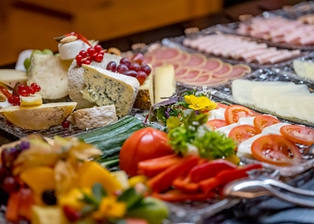 cold cuts and cheese platter with vegetables