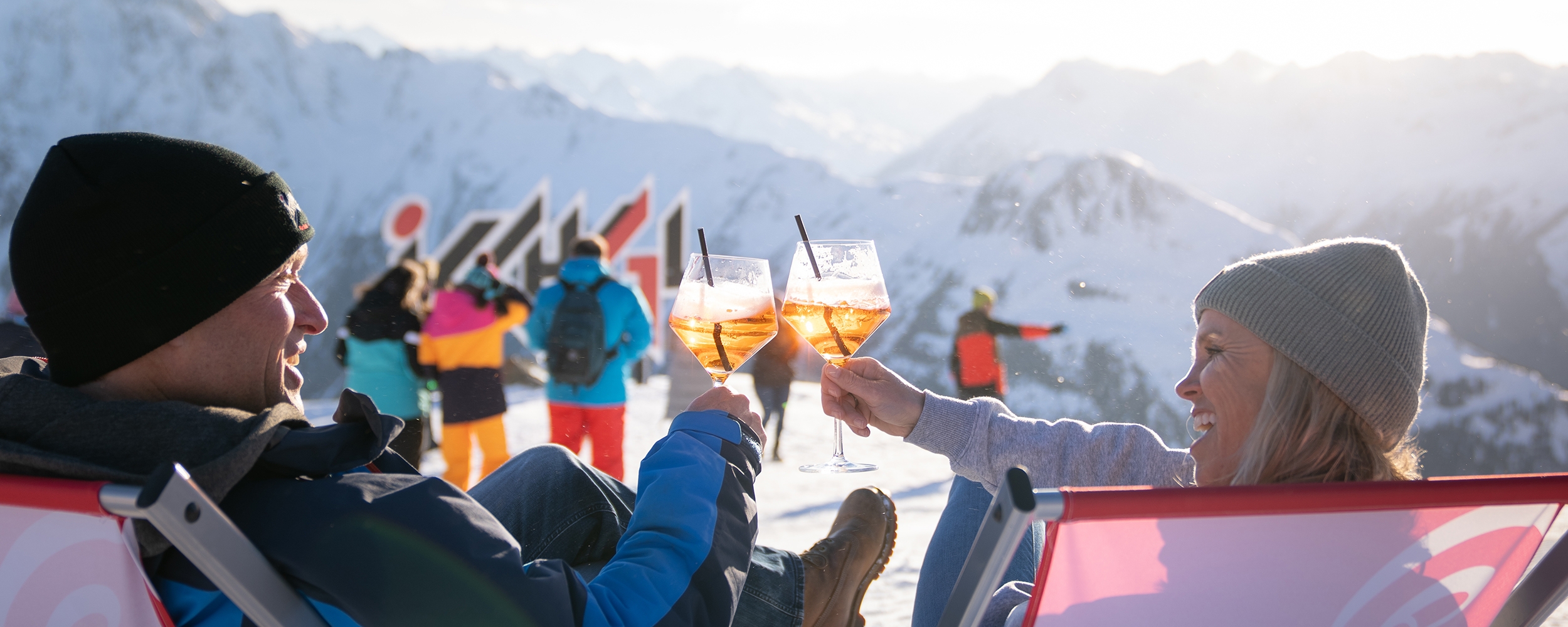 Couple with Aperol on the ski slope